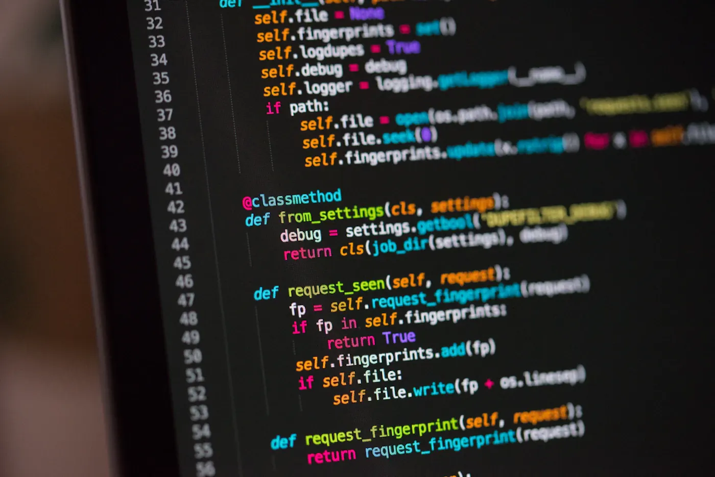 Computer screen showing programming text in a technology workspace